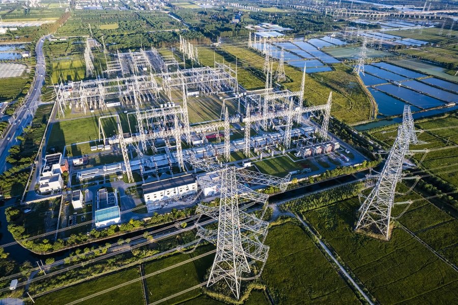 Aerial view of Electricity pylons and a big Electrical substation