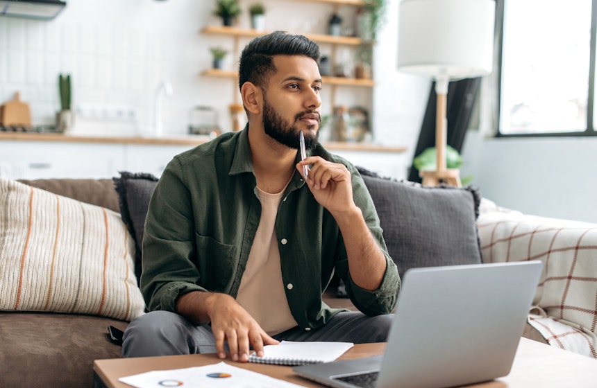 An international student in Canada checking his tuition payment status online.